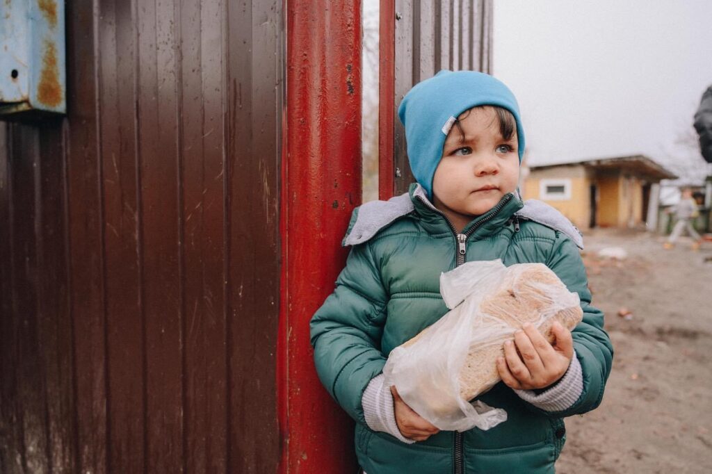 not for social media, only mail or email. young boy and bread